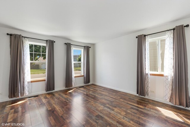 261 E Camden Ln, Round Lake Beach, IL 60073 - empty room with wood-type flooring and baseboards