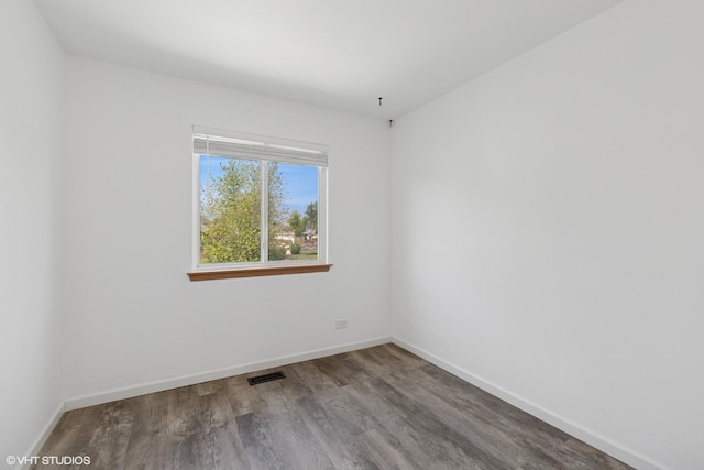 261 E Camden Ln, Round Lake Beach, IL 60073 - spare room with wood finished floors and baseboards