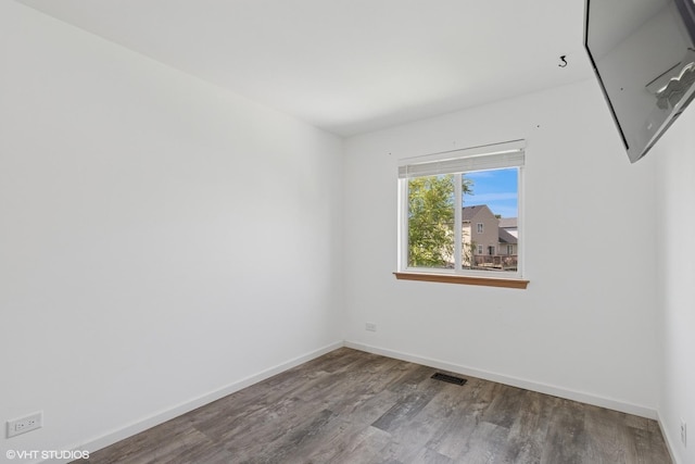 261 E Camden Ln, Round Lake Beach, IL 60073 - unfurnished room featuring wood finished floors and baseboards