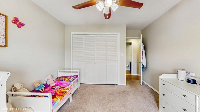 6833 N Kedzie Ave Unit 716, Chicago, IL 60645 - bedroom featuring light colored carpet, a closet, and ceiling fan