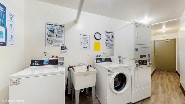 6833 N Kedzie Ave Unit 716, Chicago, IL 60645 - community laundry room with stacked washer / dryer, separate washer and dryer, and light wood-style floors