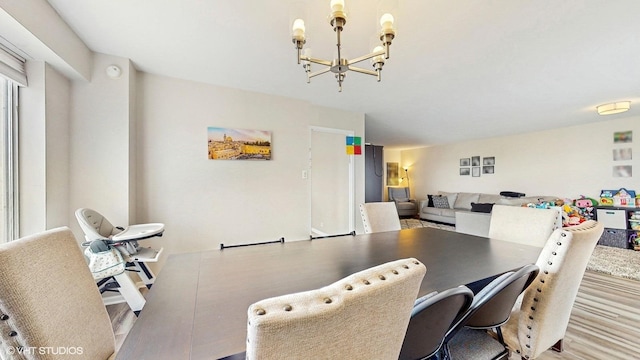 6833 N Kedzie Ave Unit 716, Chicago, IL 60645 - dining space with a chandelier and wood finished floors