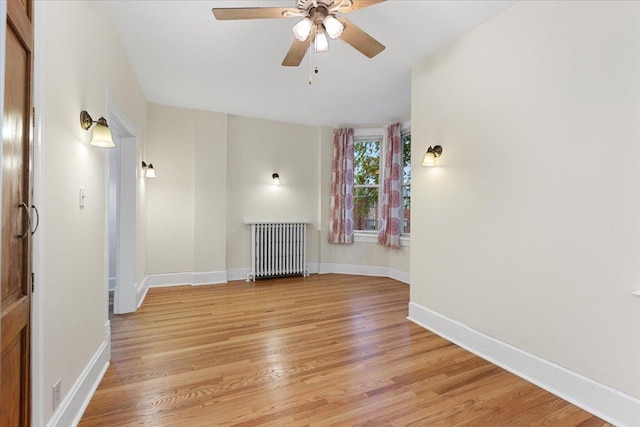 3357 S Oakley Ave, Chicago, IL 60608 - empty room featuring radiator heating unit, a ceiling fan, light wood-style floors, and baseboards