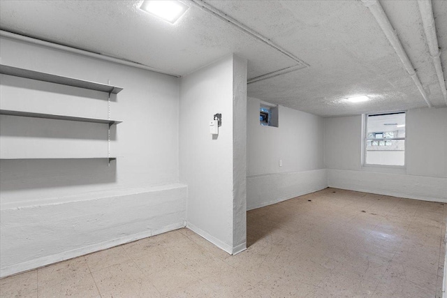 3357 S Oakley Ave, Chicago, IL 60608 - basement featuring tile patterned floors and a textured ceiling