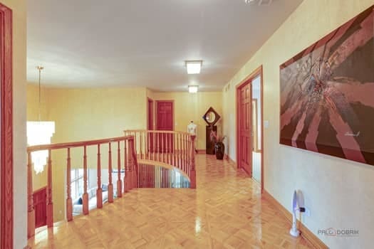 hall featuring an upstairs landing