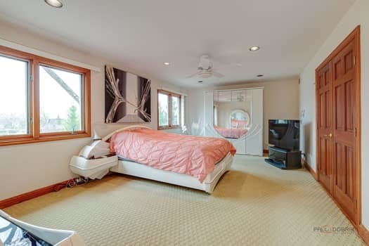 carpeted bedroom featuring recessed lighting, baseboards, and a ceiling fan