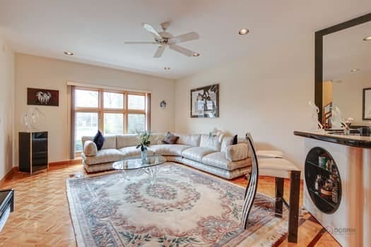 living room with ceiling fan, recessed lighting, and baseboards