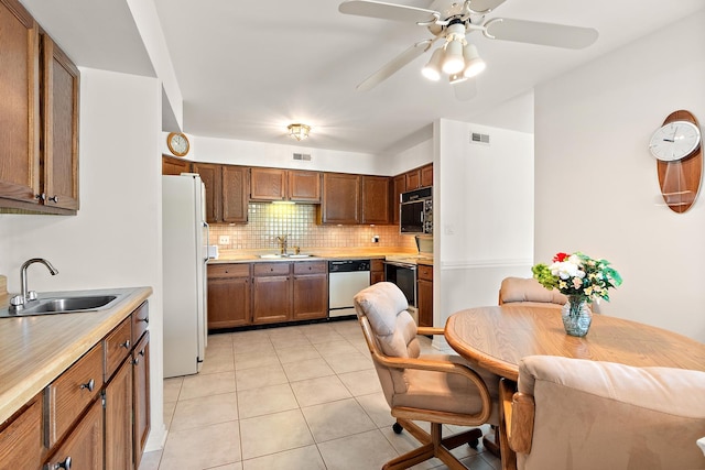 9900 Shady Ln Unit 3Ne, Orland Park, IL 60462 - kitchen with white appliances, ceiling fan, backsplash, light countertops, and light tile patterned flooring