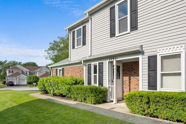 1795 Vermont Dr Unit A, Elk Grove Village, IL 60007 - view of front of house featuring brick siding and a front yard