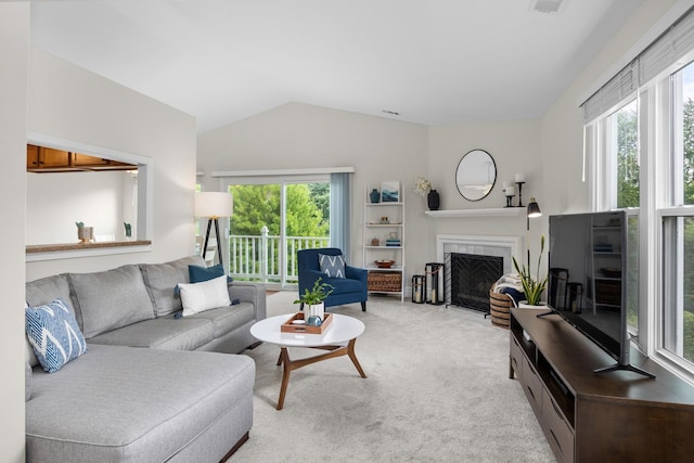 1795 Vermont Dr Unit A, Elk Grove Village, IL 60007 - carpeted living area with lofted ceiling, healthy amount of natural light, and a tiled fireplace