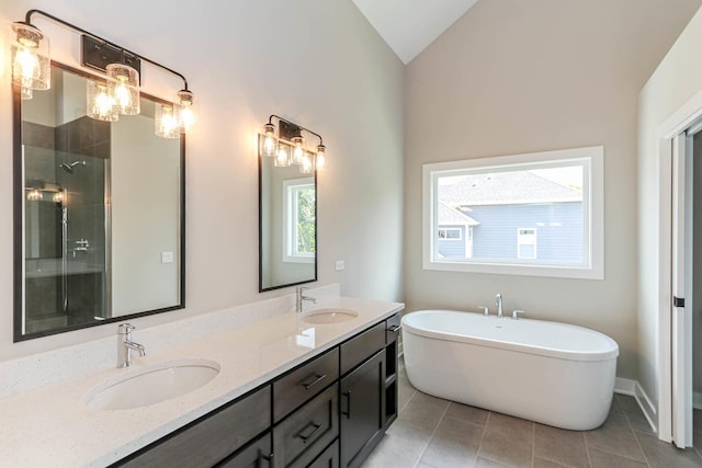 26101 W Forrester Dr, Plainfield, IL 60585 - full bathroom featuring double vanity, a freestanding bath, tile patterned floors, lofted ceiling, and a shower
