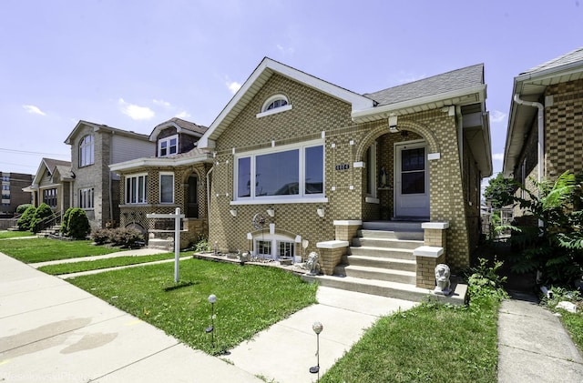 4024 N Overhill Ave, Norridge, IL 60706 - view of front facade featuring brick siding and a front yard
