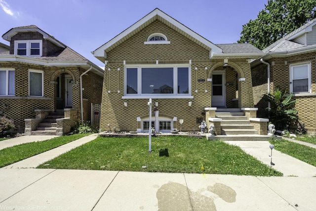 4024 N Overhill Ave, Norridge, IL 60706 - bungalow with brick siding and a front lawn