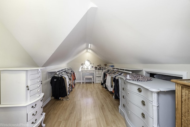4024 N Overhill Ave, Norridge, IL 60706 - walk in closet with light wood-style floors and vaulted ceiling