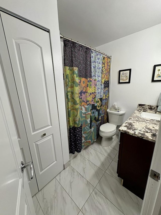 21 W Goethe St Unit 18D, Chicago, IL 60610 - bathroom with vanity, marble look tile flooring, and a shower with curtain