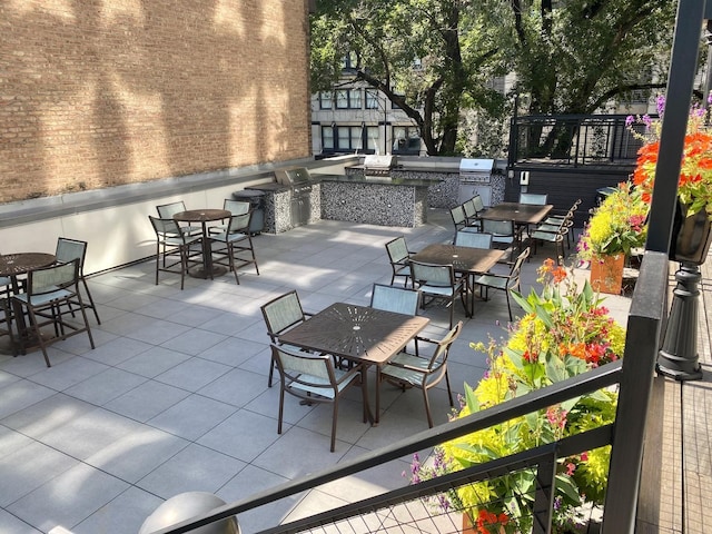 21 W Goethe St Unit 18D, Chicago, IL 60610 - view of patio featuring outdoor dining space and exterior kitchen