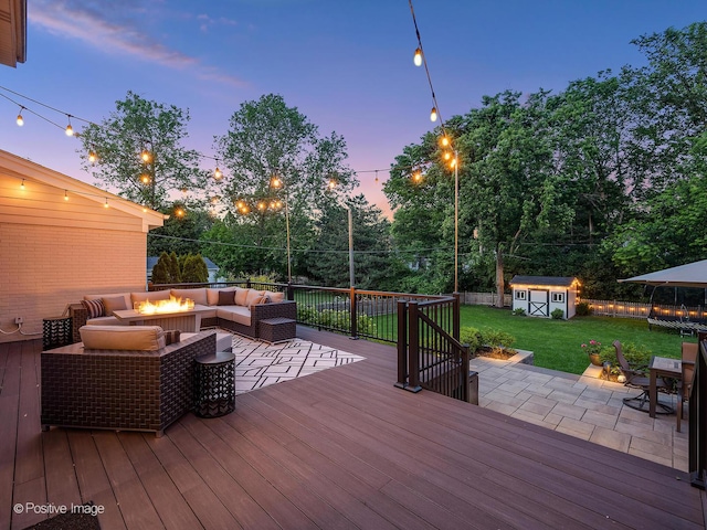 195 N Park Blvd, Glen Ellyn, IL 60137 - wooden deck featuring an outdoor living space with a fire pit, a shed, a patio, a fenced backyard, and outdoor dining space