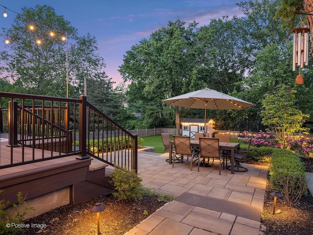 195 N Park Blvd, Glen Ellyn, IL 60137 - fenced backyard featuring outdoor dining space, stairway, a storage shed, a patio area, and a wooden deck