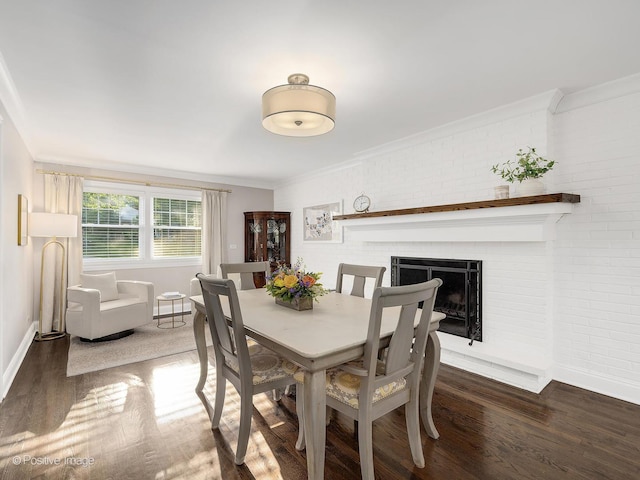 195 N Park Blvd, Glen Ellyn, IL 60137 - dining space with wood finished floors, ornamental molding, a brick fireplace, and brick wall