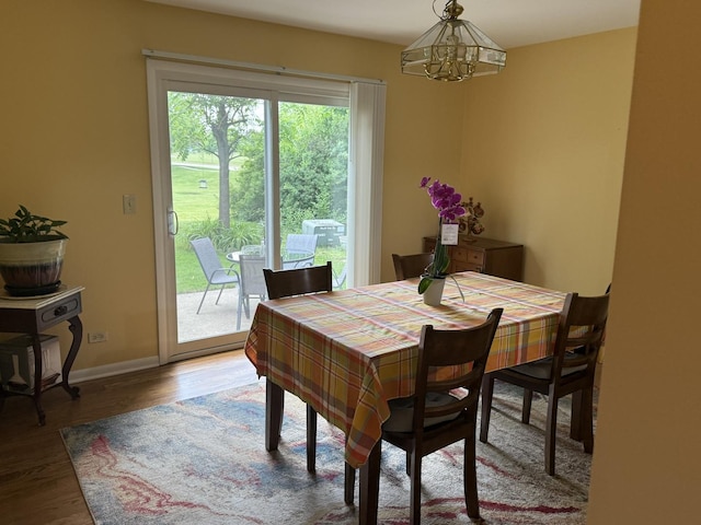 1742 Victor Ter, Gurnee, IL 60031 - dining space featuring a chandelier, wood finished floors, and baseboards