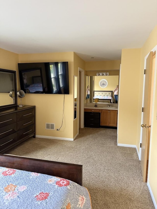 1742 Victor Ter, Gurnee, IL 60031 - bedroom with carpet, baseboards, a sink, and ensuite bathroom
