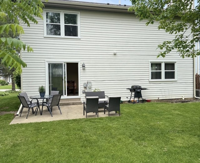 1742 Victor Ter, Gurnee, IL 60031 - rear view of house with a patio and a lawn