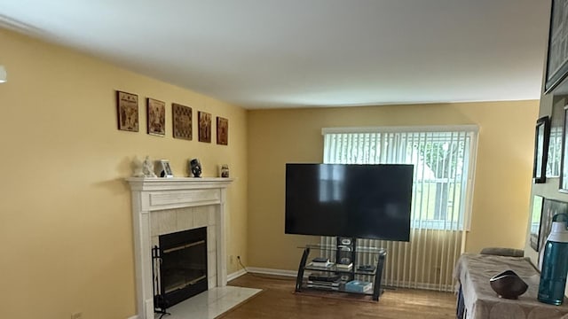 1742 Victor Ter, Gurnee, IL 60031 - living area with wood finished floors, a tile fireplace, and baseboards