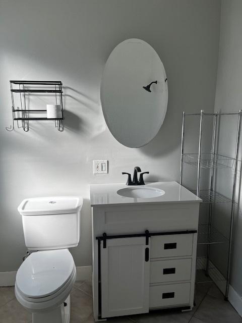 bathroom featuring vanity and baseboards