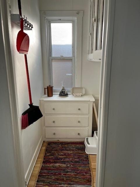 bathroom featuring wood finished floors and baseboards