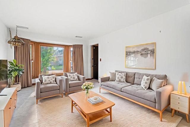 5129 N Normandy Ave, Chicago, IL 60656 - living room with a chandelier and light colored carpet