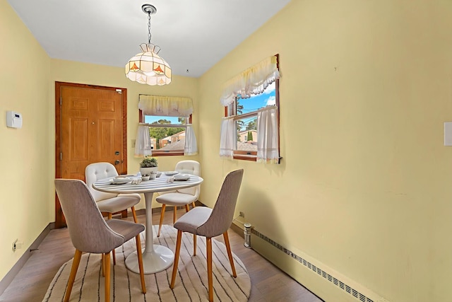 5129 N Normandy Ave, Chicago, IL 60656 - dining space with a baseboard heating unit and wood finished floors