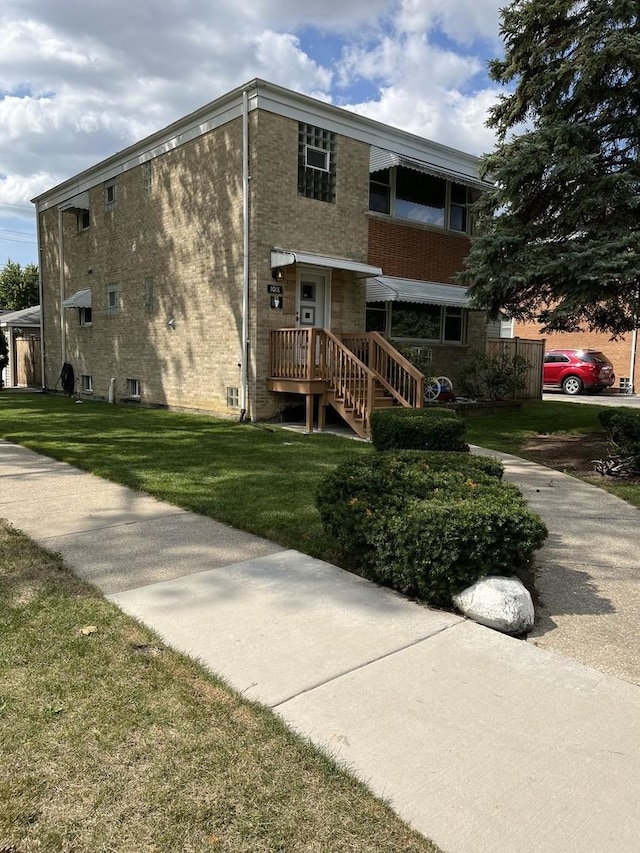 1018 E Oak Ave, La Grange Park, IL 60526 - view of front of house with a front yard and brick siding