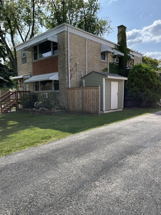 1018 E Oak Ave, La Grange Park, IL 60526 - view of property exterior featuring a chimney and brick siding