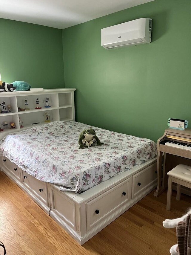 1018 E Oak Ave, La Grange Park, IL 60526 - bedroom with an AC wall unit and light wood finished floors