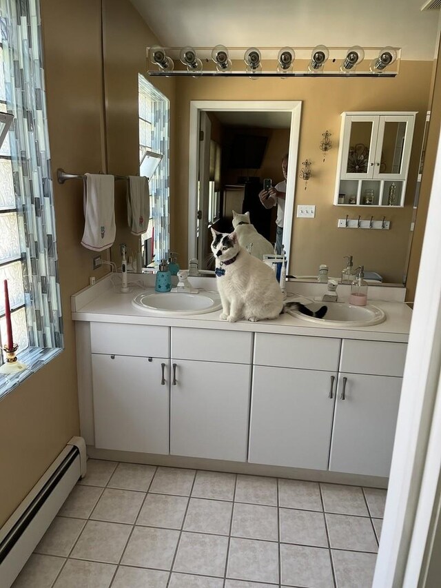 1018 E Oak Ave, La Grange Park, IL 60526 - bathroom with baseboard heating, double vanity, and tile patterned floors