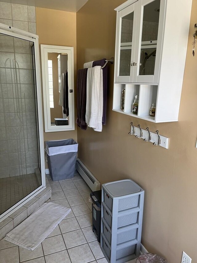 1018 E Oak Ave, La Grange Park, IL 60526 - bathroom with a baseboard heating unit, a shower stall, and tile patterned floors
