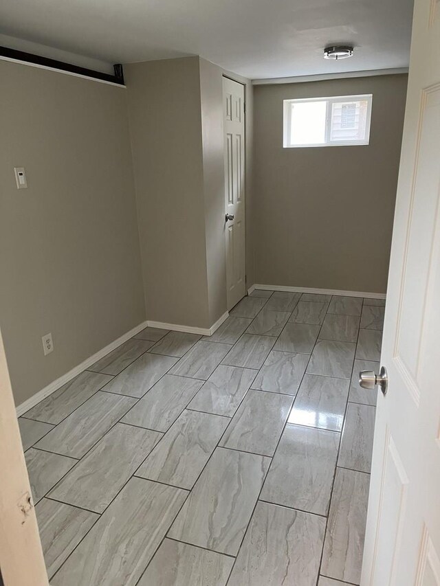 1018 E Oak Ave, La Grange Park, IL 60526 - spare room with marble finish floors and baseboards