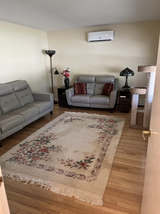 1018 E Oak Ave, La Grange Park, IL 60526 - living area with a wall unit AC and wood finished floors