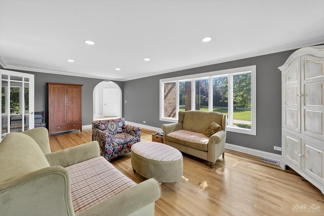 1714 Il Route 173, Spring Grove, IL 60081 - living area with baseboards, arched walkways, crown molding, light wood-type flooring, and recessed lighting
