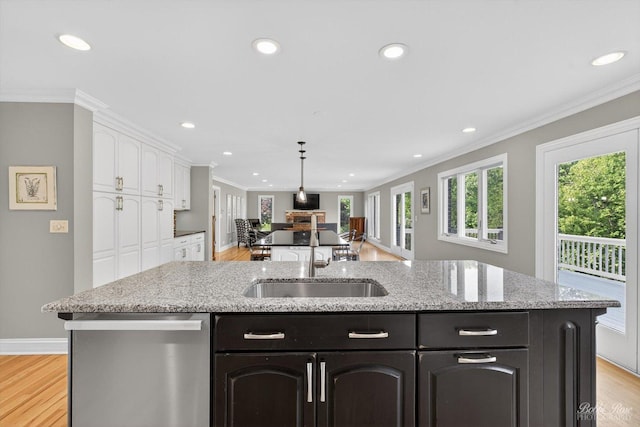 1714 Il Route 173, Spring Grove, IL 60081 - kitchen featuring stainless steel dishwasher, a sink, white cabinetry, an island with sink, and recessed lighting