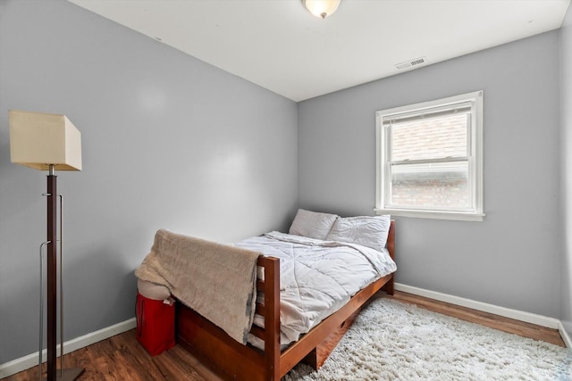 5905 S Indiana Ave, Chicago, IL 60637 - bedroom featuring baseboards and wood finished floors