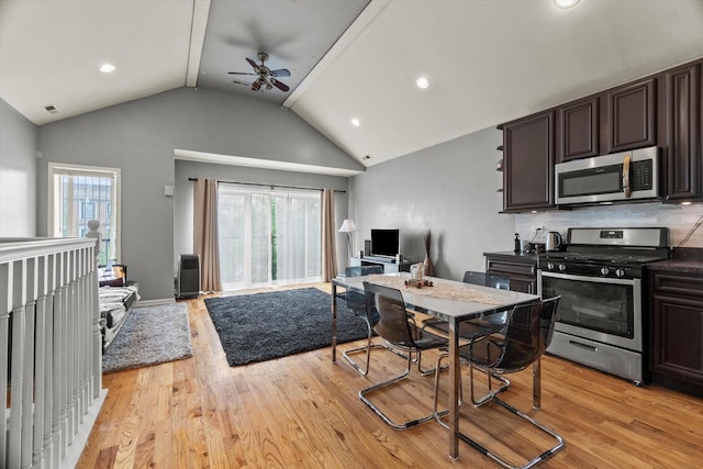 5905 S Indiana Ave, Chicago, IL 60637 - kitchen with stainless steel appliances, open floor plan, vaulted ceiling, light wood-style floors, and dark brown cabinets