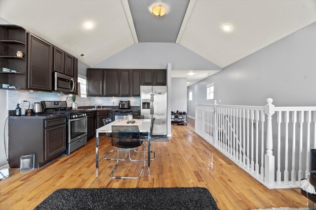 5905 S Indiana Ave, Chicago, IL 60637 - kitchen with stainless steel appliances, dark brown cabinets, open shelves, light wood-style floors, and vaulted ceiling