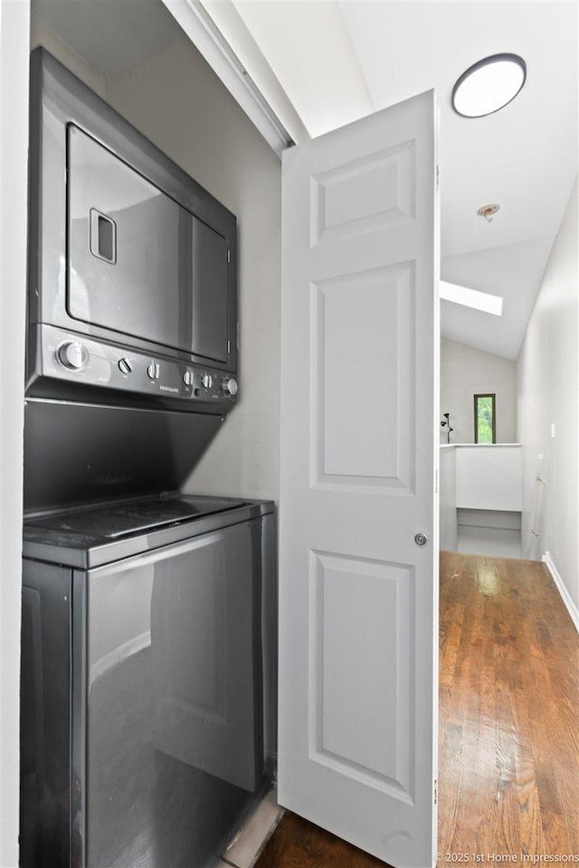 1457 E 71st Pl Unit 3, Chicago, IL 60619 - washroom featuring estacked washer and dryer and dark wood-type flooring