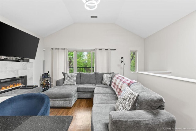 1457 E 71st Pl Unit 3, Chicago, IL 60619 - living room featuring wood finished floors, a tile fireplace, and lofted ceiling