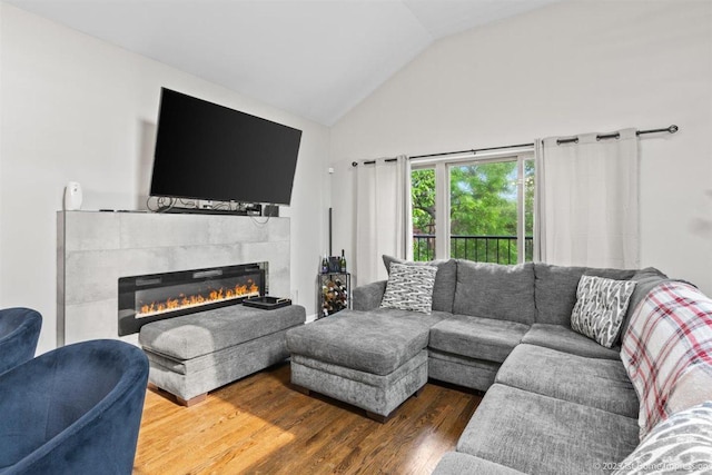 1457 E 71st Pl Unit 3, Chicago, IL 60619 - living room with a tile fireplace, vaulted ceiling, and wood finished floors