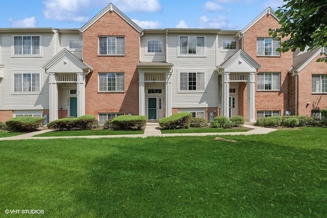 2031 Concord Dr Unit 2031, Mchenry, IL 60050 - view of property with a front lawn and brick siding