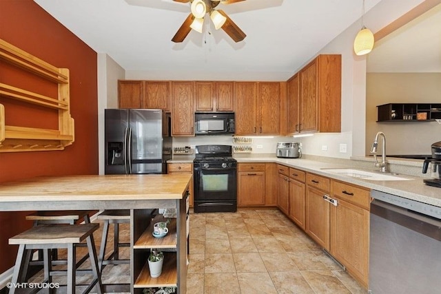 2031 Concord Dr Unit 2031, Mchenry, IL 60050 - kitchen featuring black appliances, open shelves, ceiling fan, and brown cabinets