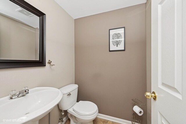 2031 Concord Dr Unit 2031, Mchenry, IL 60050 - half bathroom featuring a sink and toilet