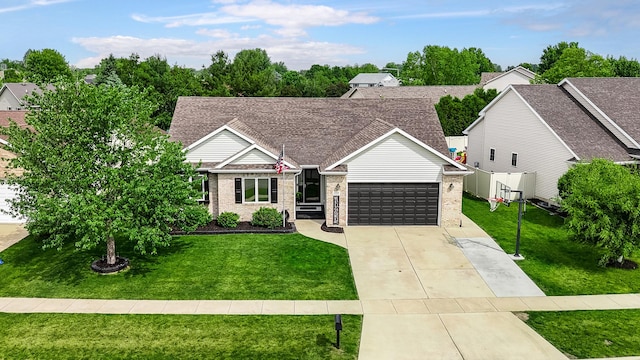 1125 Oxford Cir, Sycamore, IL 60178 - view of front of property featuring a front lawn, a garage, driveway, and brick siding